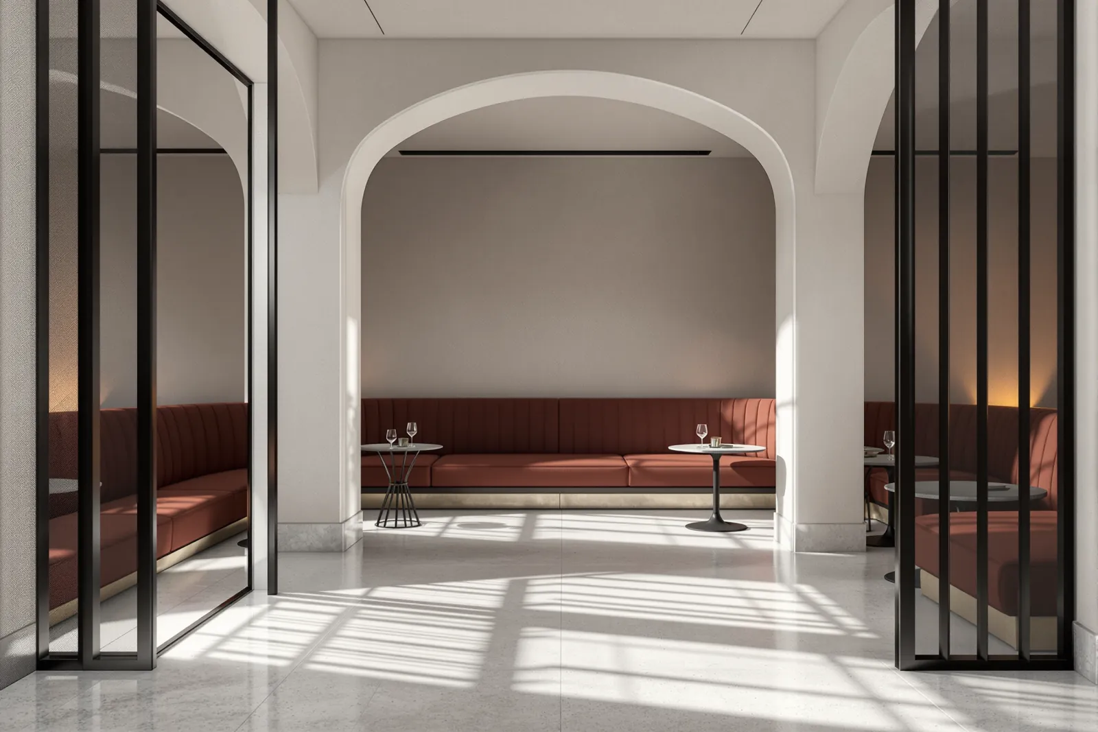 A boutique commercial interior with chalk plaster, ink-black steel screens, pale stone floor and muted clay banquette seating.
